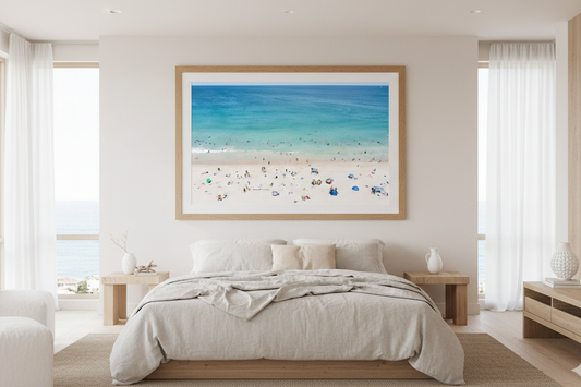 Modern bedroom with a large framed beach scene on the wall