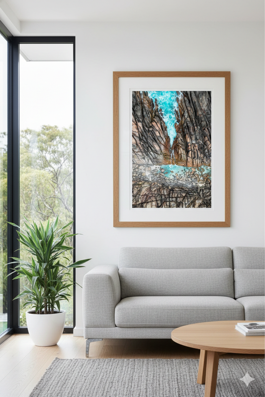 Framed abstract artwork on a wall above a sofa in a living room