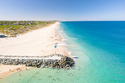 Beach scene with clear blue water and white sand