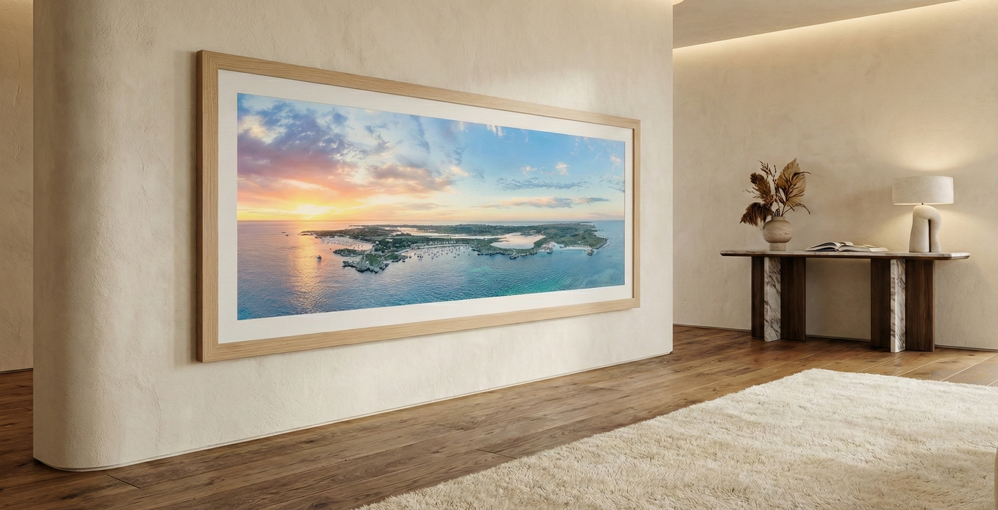 Large framed artwork of a sunset over water in a modern living room. Rottnest Island panorama.