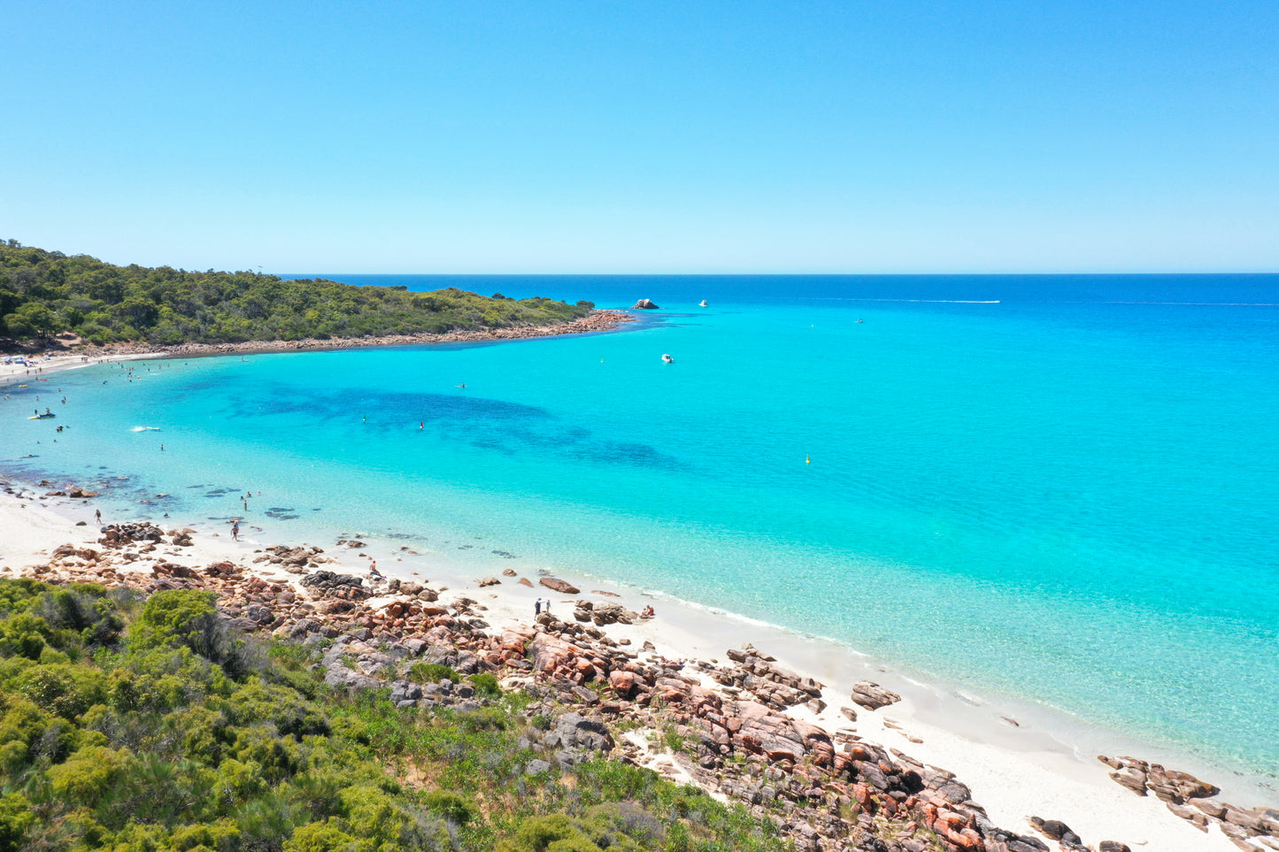 A vibrant print of Meelup Beach with a clear blue ocean and sandy shoreline, framed by green vegetation.