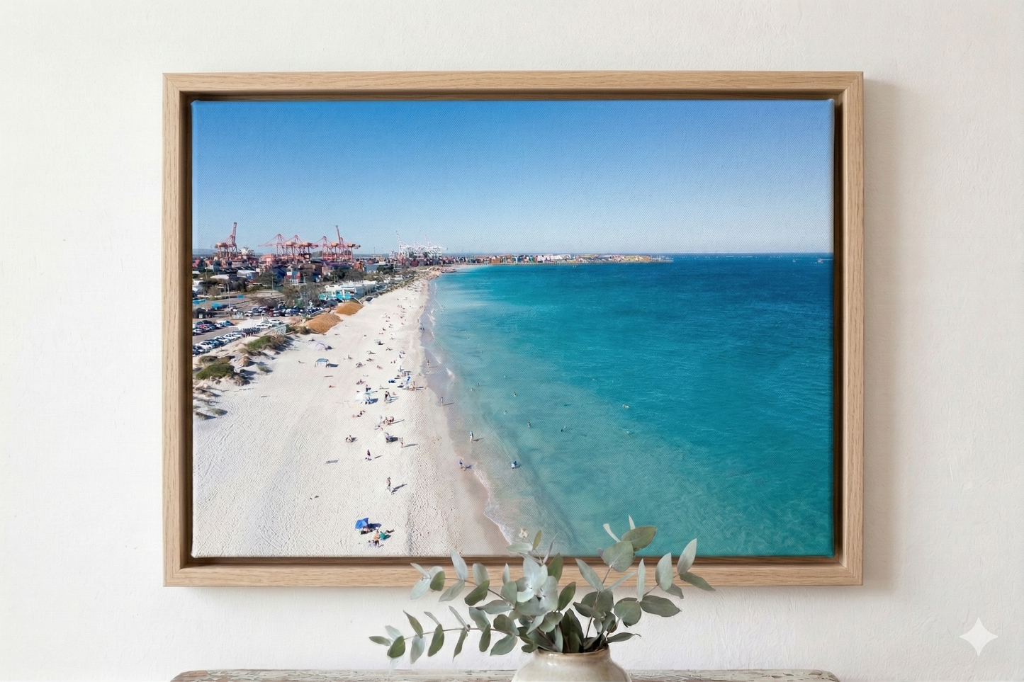 Framed photograph of a beach scene with clear blue sky and ocean.