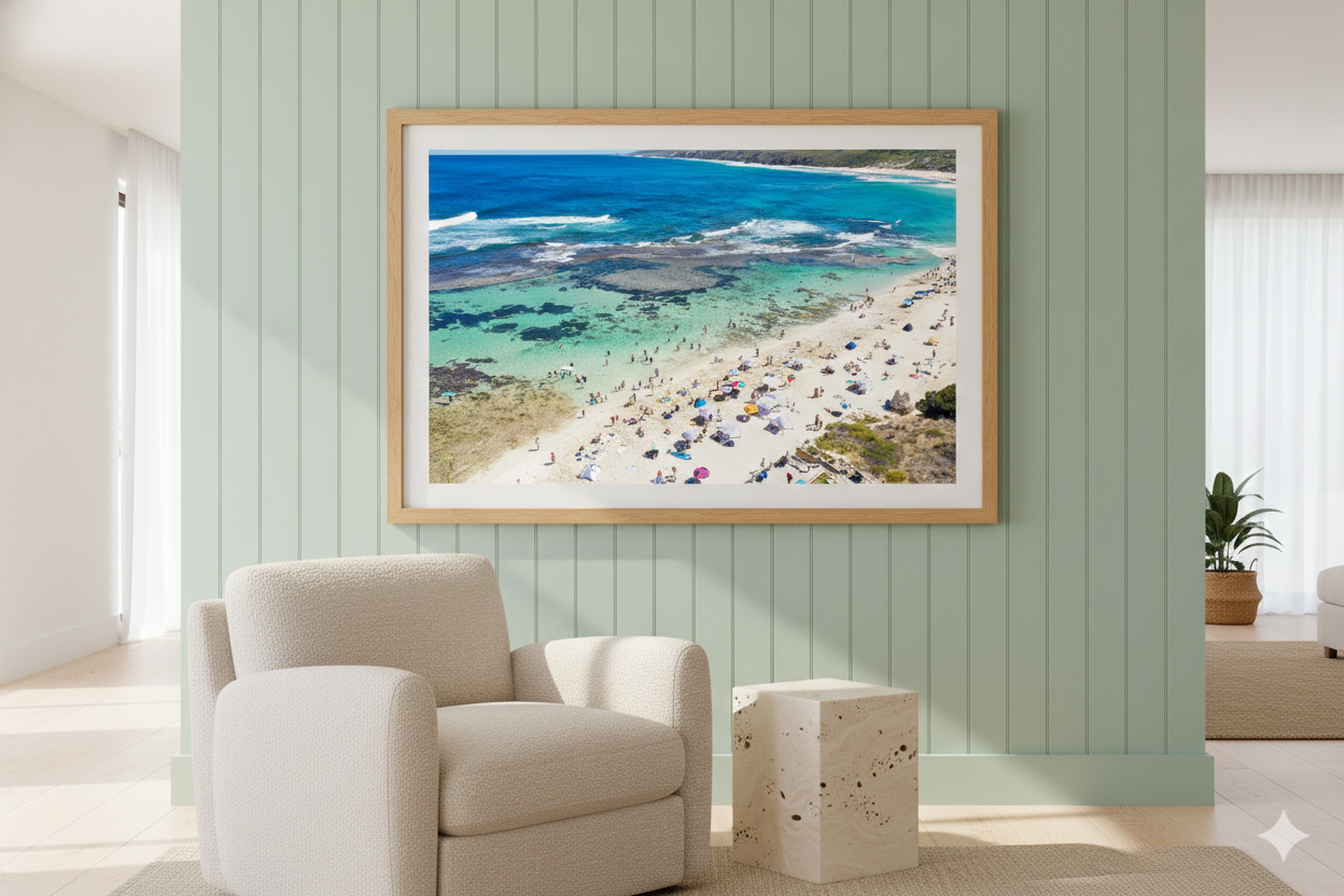 Framed artwork of a beach scene on a wall in a modern living room.